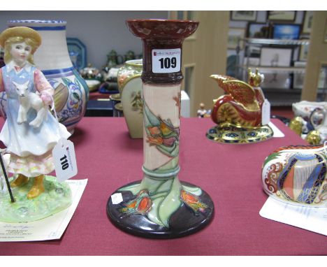 A Moorcroft Pottery Candlestick, tubelined and painted in the Red Tulip pattern against a cream ground with red/brown circula