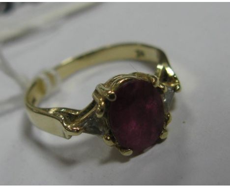 A Ruby Ring, oval claw set to the centre, between triangular inset shoulders, stamped "14K".