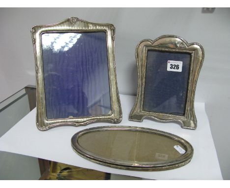 A Chester Hallmarked Silver Mounted Rectangular Photograph Frame, engine turned, on easel back; together with a smaller examp