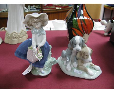 Lladro Pottery Girl with Flowers, 18cm high, Nao two puppy group. (2)