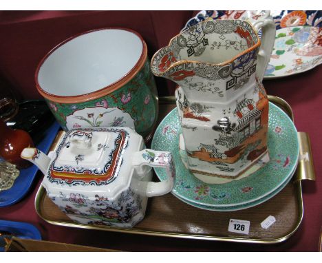 A Pair of Chinese Plates, painted with figures in conversation beneath a tree, scroll border; a Chinoiserie decorated jardini