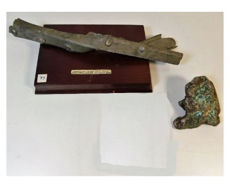 A fragment of the Ernst Scherzer commanded LZ85 Zeppelin mounted on wooden plinth. The Zeppelin was shot down by HMS Aga at M