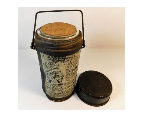 A tin hot &amp; cold flask. Provenance: Submitted by Mrs. Lauraine Sadleir MBE &amp; the late Mr. Michael R. Sadleir 