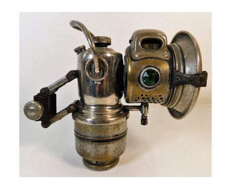 A 1928-30 Acetylene bicycle lamp by Desmo. Provenance: Submitted by Mrs. Lauraine Sadleir MBE &amp; the late Mr. Michael R. S