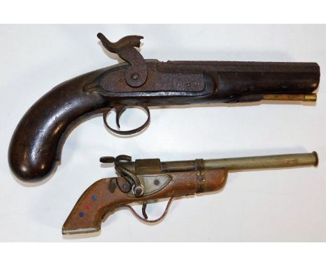 A handmade toy Indian made side lock pistol twinned with a 19thC. flintlock a/f. Provenance: Submitted by Mrs. Lauraine Sadle