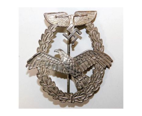 A WW2 Nazi Germany Third Reich C. E. Junker, Berlin powered flight badge, head missing at top. Provenance: Submitted by Mrs. 