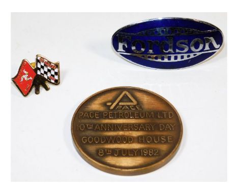 A Fordson tractor badge, a TT races brooch &amp; a Goodwood pace medal 