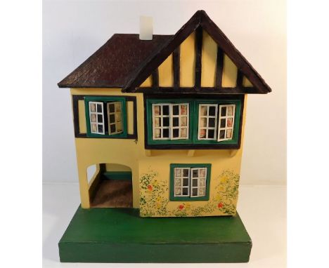 A vintage Triang dolls house approx. 17in tall x 13.5in wide