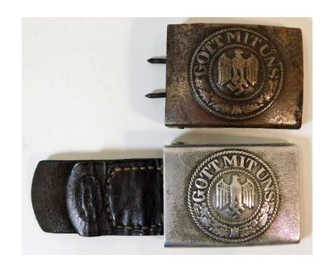 A WW2 era Nazi Germany Third Reich steel belt buckle twinned with Harrman Aluminium buckle. Provenance: Submitted by Mrs. Lau