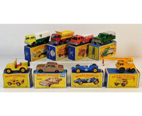 Eight boxed Matchbox diecast toy vehicles: Ford Cortina GT no.25, Fire pumper truck no.29, VRM racing car no.52, BP tanker no