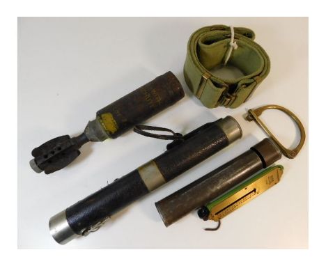 A British army web belt, a brass kit shackle, an ever ready torch &amp; a British army 2in parachute flare bomb. Provenance: 