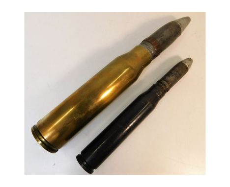 A German 20mm Flugabwehrkanone shell twinned with a 2mm Aden Cannon shell. Provenance: Submitted by Mrs. Lauraine Sadleir MBE