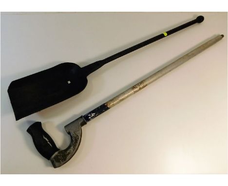 A British army extendable mine probe twinned with a WW2 Barrack room stove shovel. Provenance: Submitted by Mrs. Lauraine Sad