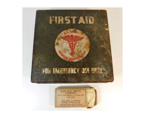 A WW2 US army first aid tin &amp; one packaged bandage. Provenance: Submitted by Mrs. Lauraine Sadleir MBE &amp; the late Mr.