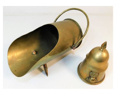 A brass trench art shell fashioned as coal scuttle twinned with a brass trench art bottle opener in the form of a Pickelhaube