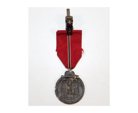 A WW2 Nazi Germany Third Reich Eastern Front medal. Provenance: Submitted by Mrs. Lauraine Sadleir MBE &amp; the late Mr. Mic