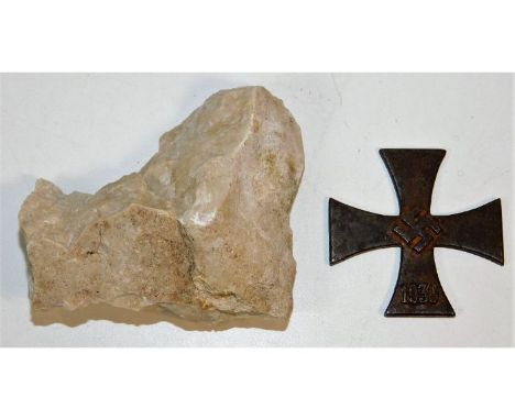 A German WW2 iron cross centre twinned with a fragment from the battle ground at Monte Cassino. Provenance: Submitted by Mrs.