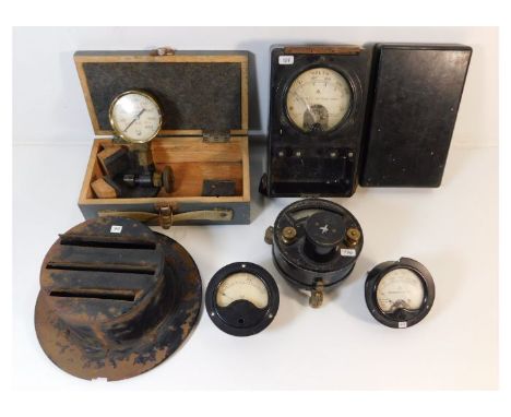 An Admiralty voltmeter, a W.D voltmeter a/f, a WW2 vehicle lamp blackout shroud &amp; other items. Provenance: Submitted by M