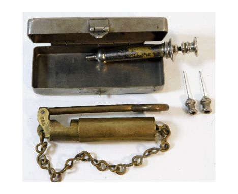 A WW1 hypodermic morphine needle kit twinned with a WW1 brass bore inspection mirror for S.M.L.E rifle. Provenance: Submitted