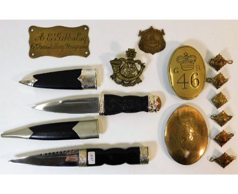 Two Scottish sgian-dubh daggers twinned with brass badges &amp; other items. Provenance: Submitted by Mrs. Lauraine Sadleir M