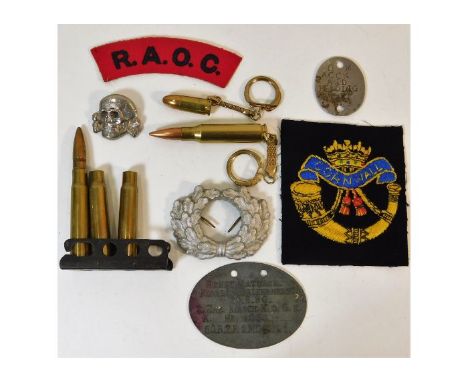 A German style skull pin, a Nazi German oak leaf wreath cap badge, a German tag "Ernst Matusch no.3040" &amp; other items. Pr
