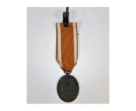 A WW2 Nazi Germany Third Reich West Wall medal. Provenance: Submitted by Mrs. Lauraine Sadleir MBE &amp; the late Mr. Michael