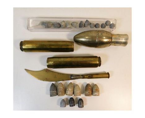 A trench art brass paper knife twinned with lead shot &amp; shells. Provenance: Submitted by Mrs. Lauraine Sadleir MBE &amp; 