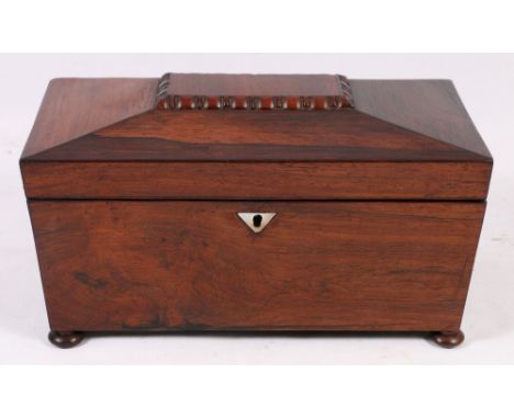19th century rosewood tea caddy of sarcophagus form with two lift out divisions and mixing well raised on bun feet, 31cm x 17