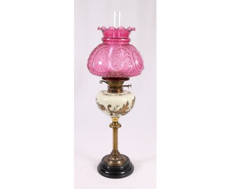 Victorian brass oil lamp with cranberry glass shade. 66cm   CONDITION REPORT:  Late 19th century.  Rubbed in areas.  Shade cl