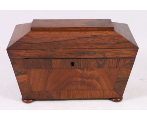 19th century crossbanded rosewood tea caddy of sarcophagus form, raised on bun feet, 28cm x 15cm x 18cm.