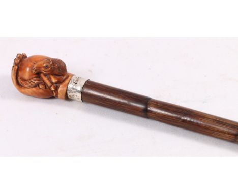 Stained wood netsuke handled walking cane with silver collar