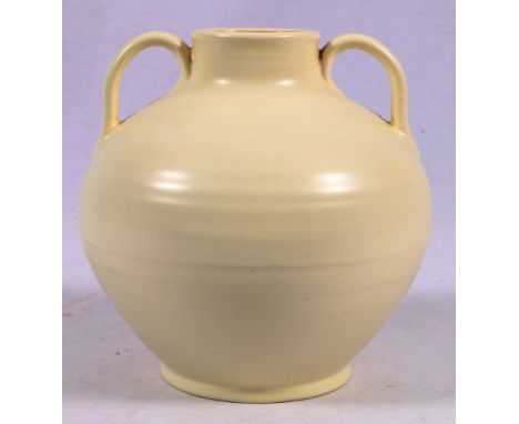 Poole Magnolia white twin handled vase, 16cm   CONDITION REPORT:  Handles scratched.  Crazing evident.  Marks on vase, surfac