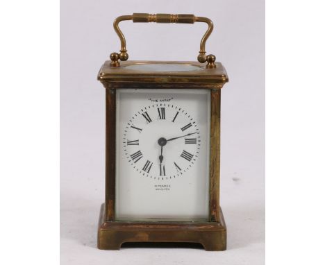 Brass carriage clock, titled "The Akrat" by Pearce of Brighton, 4cm high