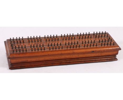 19th century De La Rue hedgehog cribbage board, with rising brass pegs, raised on four brass feet, stamped 781 to base, 5cm x