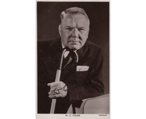 FIELDS W.C.: (1880-1946) American Film Comedian. Vintage signed postcard photograph of Fields in a half length pose holding a