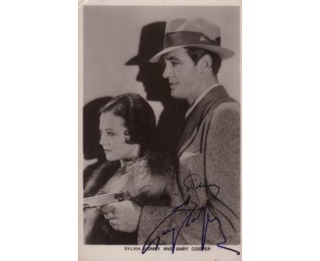 CITY STREETS: A good vintage signed postcard photograph by both Gary Cooper (The Kid) and Sylvia Sidney (Nan Cooley) individu