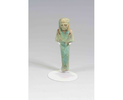 Egyptian Faience ShabtiThird Intermediate Period, Circa 900 BC.The figure is depicted in mummiform position showing agricultu