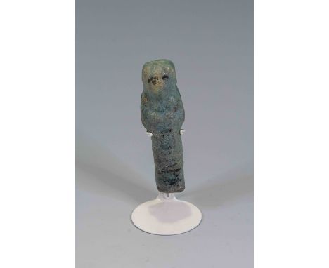 Egyptian Faience ShabtiThird Intermediate Period, Circa 900 BC.The figure is depicted in mummiform position showing agricultu