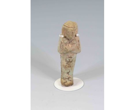 Egyptian Faience ShabtiThird Intermediate Period, Circa 900 BC.The figure is depicted in mummiform position showing agricultu
