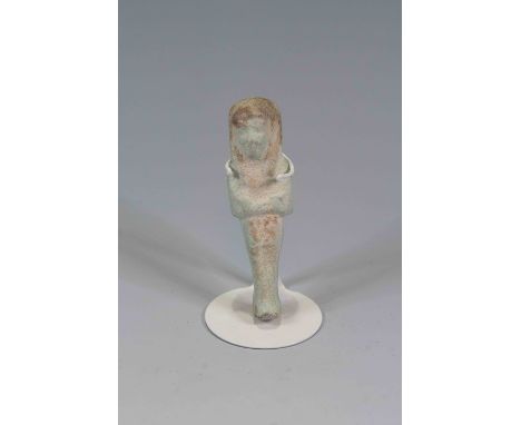 Egyptian Faience ShabtiThird Intermediate Period, Circa 900 BC.The figure is depicted in mummiform position showing agricultu