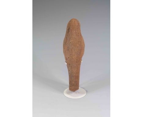 Egyptian Pottery ShabtiXIX - XX Dynasty.Mould-made mummiform worker figure wearing long tripartite wig, no beard; large eyes 