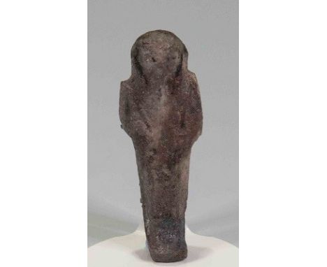 Egyptian Dark Green Faience ShabtiThird Intermediate Period, Circa 900 BC.A dark green faience figure in mummiform pose, agri