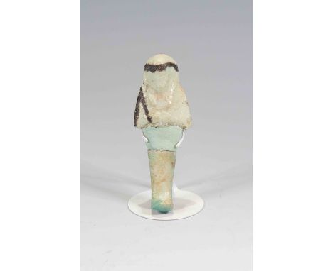 Egyptian Faience ShabtiThird Intermediate Period, Circa 900 BC.The figure is depicted in mummiform position showing agricultu