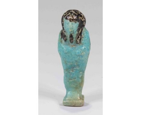 Egyptian faience shabtiLate Period, c. 525 B.C.Small mummiform figure, mould-made:  wears tripartite wig and long beard, both
