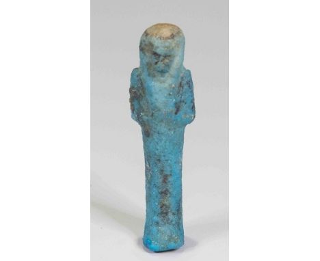 Egyptian faience shabtiLate Period, C. 525 BC.small mould-made mummiform worker figure: wears tripartite wig secured by black