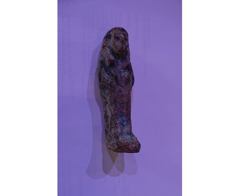 Egyptian Faience ShabtiThird Intermediate Period, Circa 900 BC.The figure is depicted in mummiform position showing agricultu