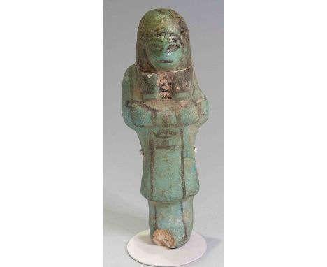 Egyptian Faience Overseer ShabtiThird Intermediate Period, Circa 900 BC.A bright bluish green faience figure in the form of a