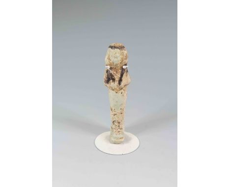 Egyptian Faience ShabtiThird Intermediate Period, Circa 900 BC.The figure is depicted in mummiform position showing agricultu