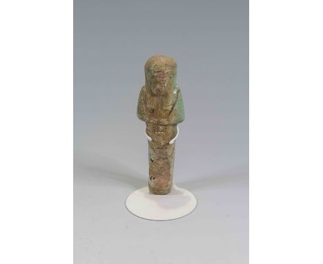 Egyptian Faience ShabtiThird Intermediate Period, Circa 900 BC.The figure is depicted in mummiform position showing agricultu