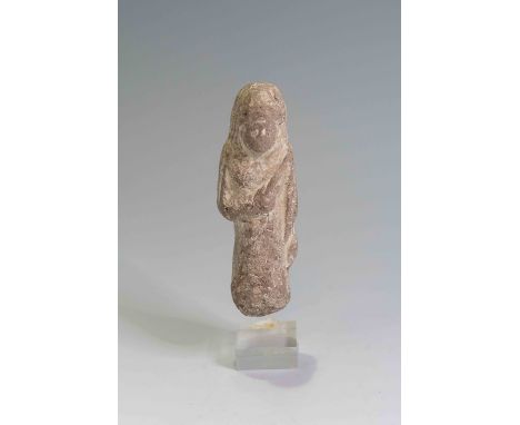 Egyptian Terracotta Overseer ShabtiThird Intermediate Period, Circa 900 BC.A figure in the form of an overseer holding two ag